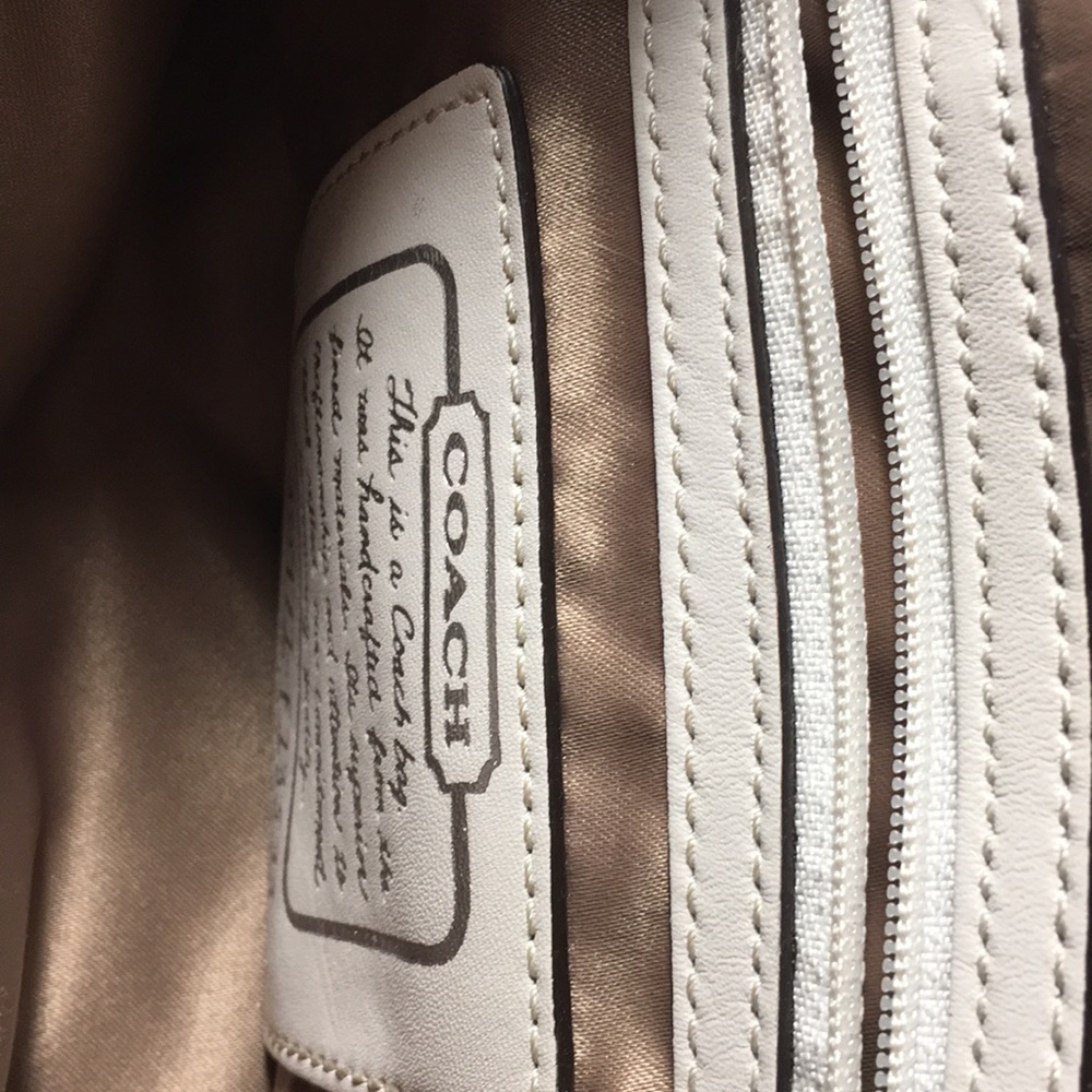 White striped and Tan Coach Pirse